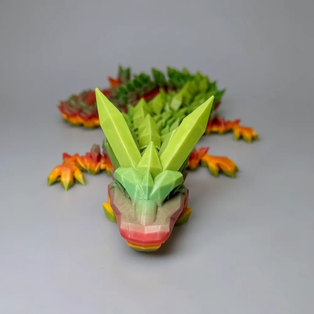 Crystal Dragon Rainbow: lime green and salmon pink dragon figurine, low-poly faceted / geometric crystalline style