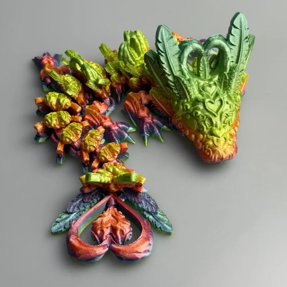 Baby Light Heart Dragon: green and yellow modular dragon figurine, curved leaf-like horns on head