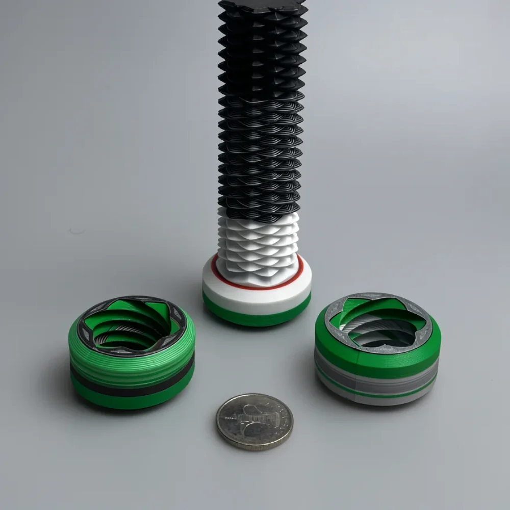 Two Way Screw: green and black mechanical component prototype, accordion-like zig-zag bellows texture on central object
