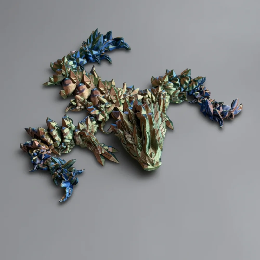Baby Jellyfish Dragon: green and blue low-poly dragon figurine, low-poly faceted geometry