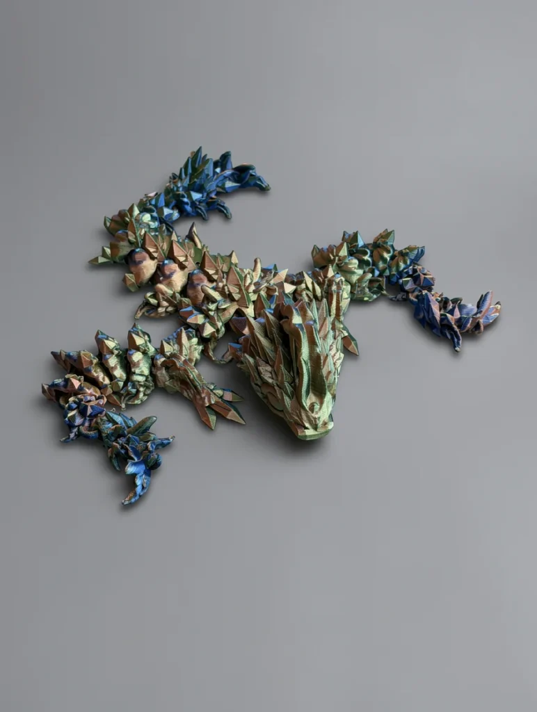 Baby Jellyfish Dragon: green and blue low-poly dragon figurine, low-poly faceted geometry