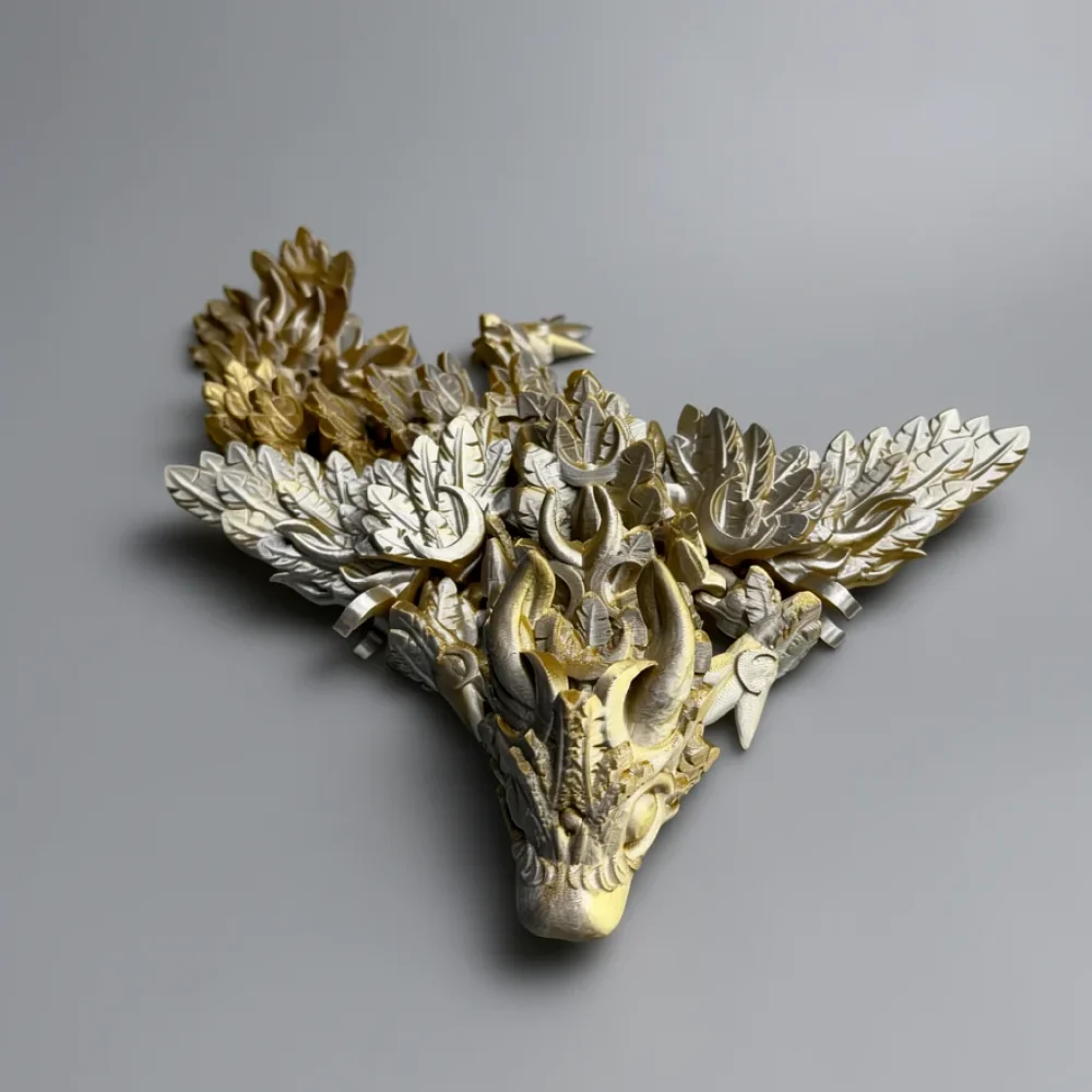 Baby Winged Lunar Dragon: gold and silver relief wall art piece featuring a stylized animal skull with foliage wings