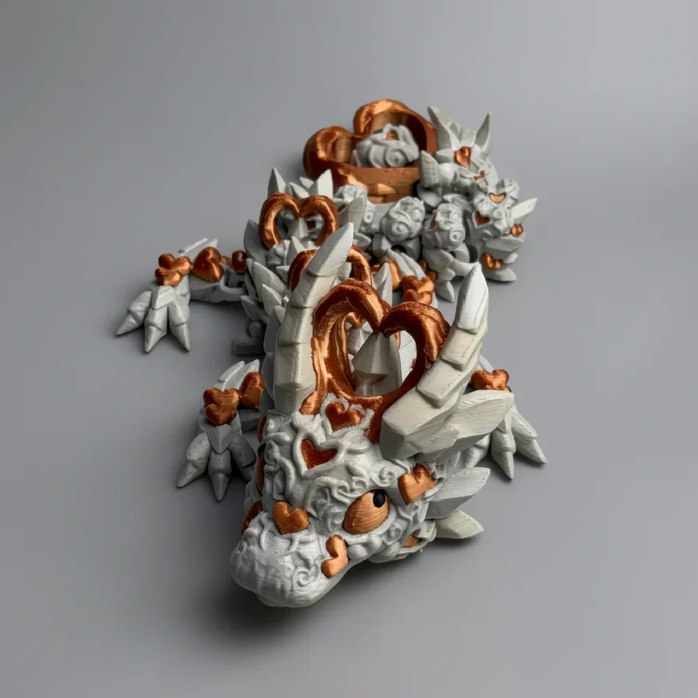 Baby Dark Heart Dragon: white and copper segmented dragon-like creature figurine