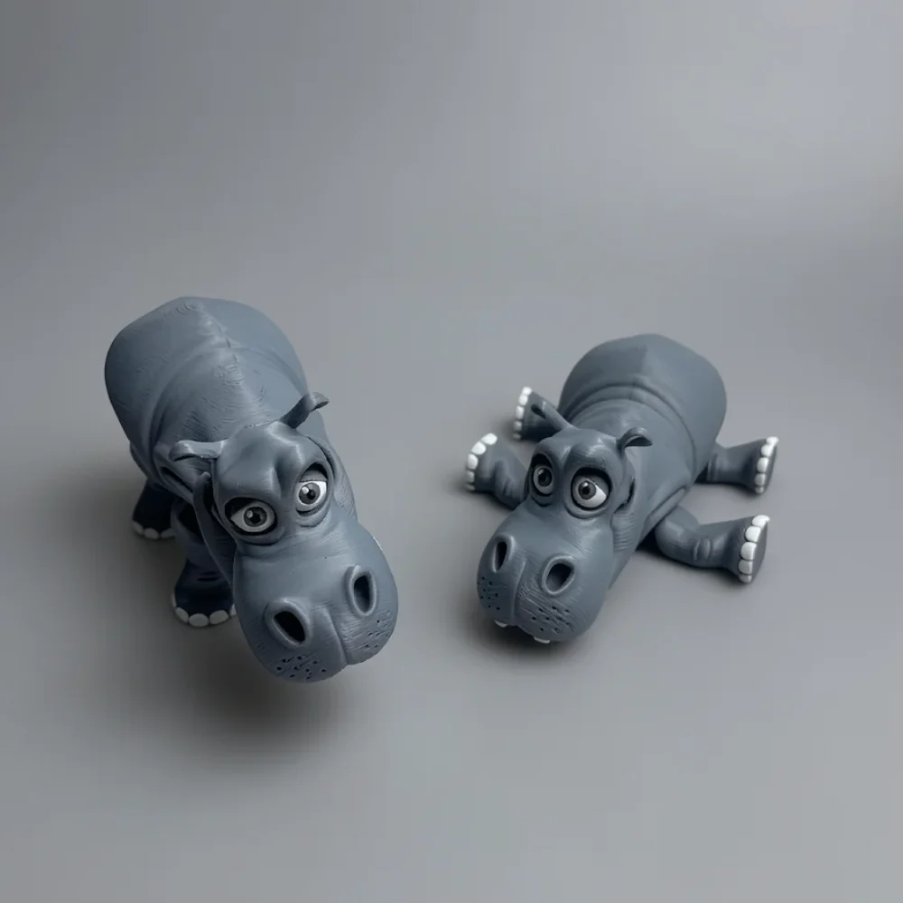 Hippo: grey-blue and white two hippopotamus figurines, large bulbous snout with dark nostrils