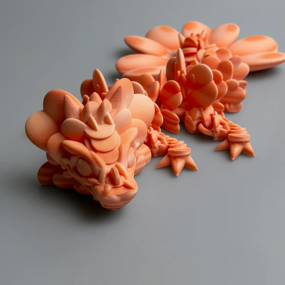 Baby Lucky Clover Dragon: peach and salmon dragon figurine, cluster of rounded conical horns on top of head