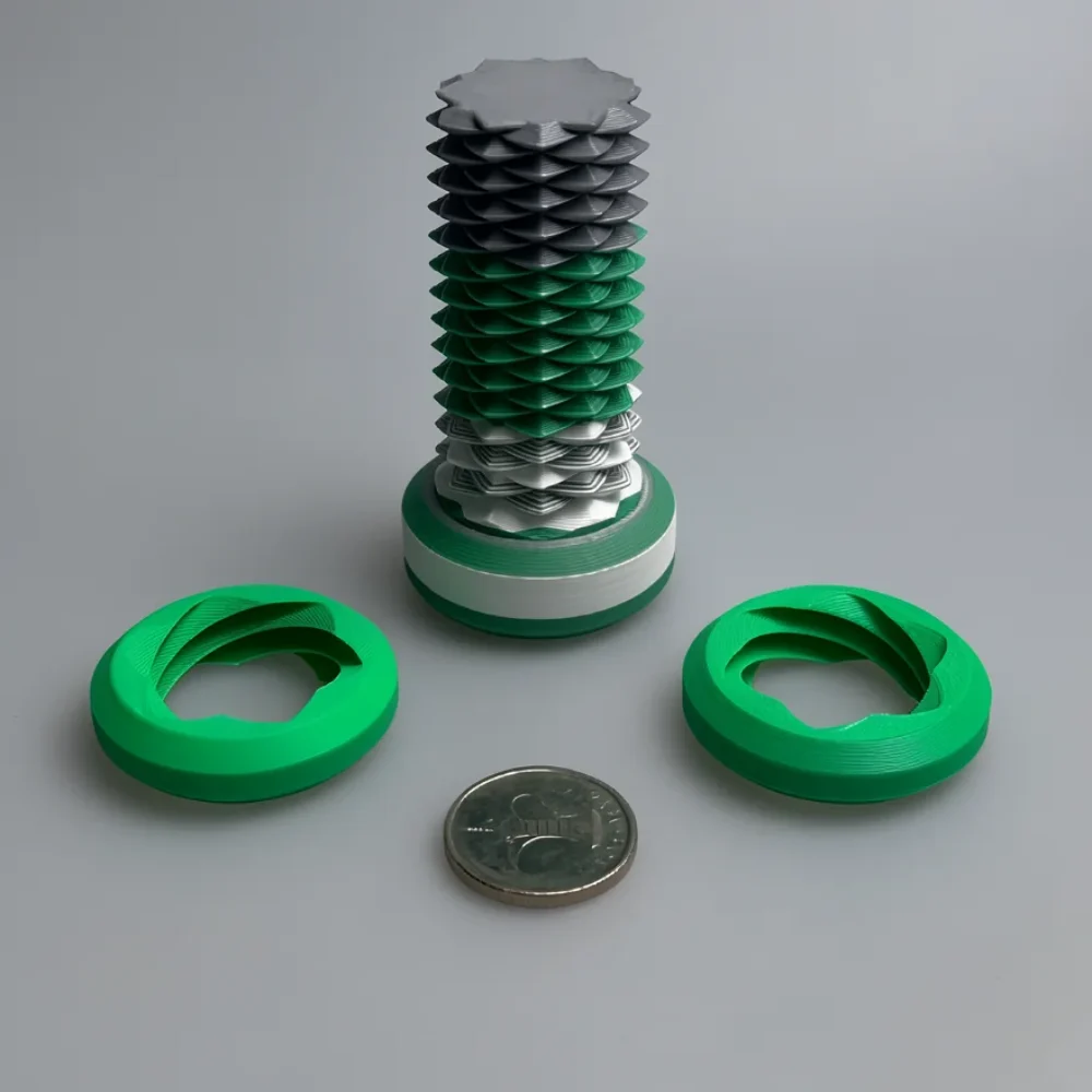 Two Way Screw: green and dark gray decorative mechanical sculpture with removable rings