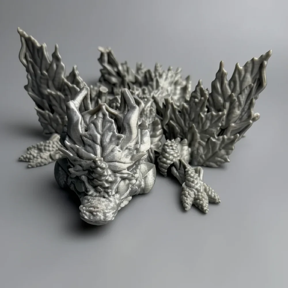 Baby Winged Autumn Dragon: grey dragon figurine with crystalline rock styling, jagged crystalline horn structures