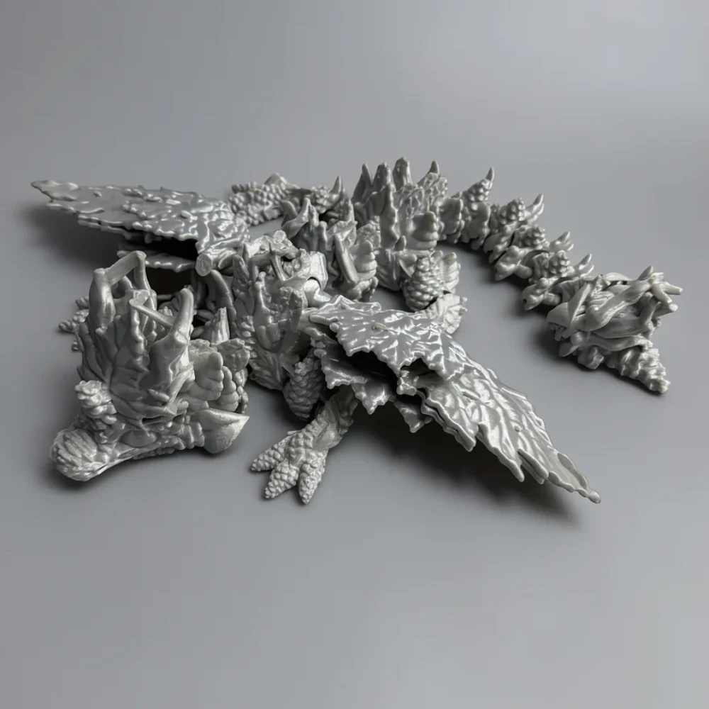 Baby Winged Autumn Dragon: white and light grey dragon figurine