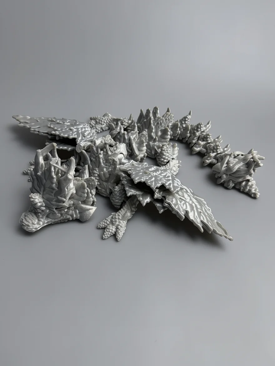 Baby Winged Autumn Dragon: white and light grey dragon figurine
