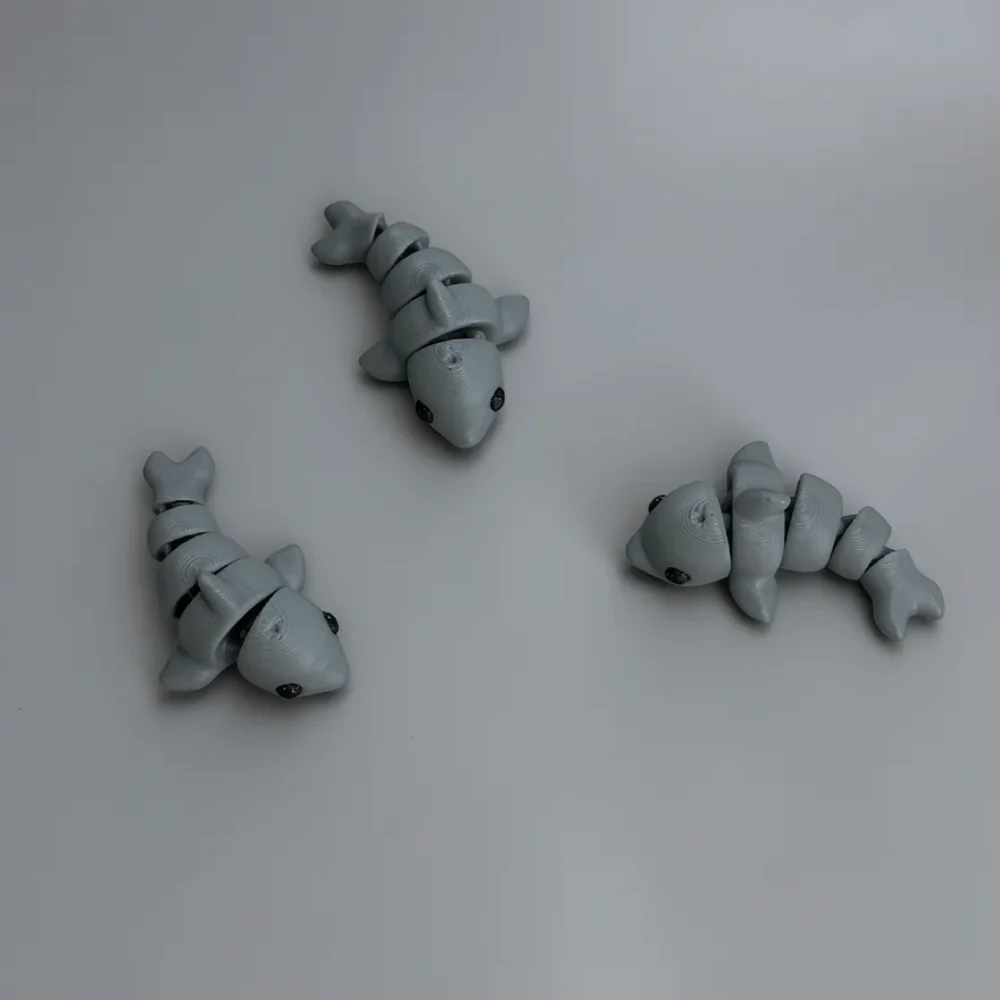 Baby Dolphin: light grey and black three articulated segmented toy fish figurines