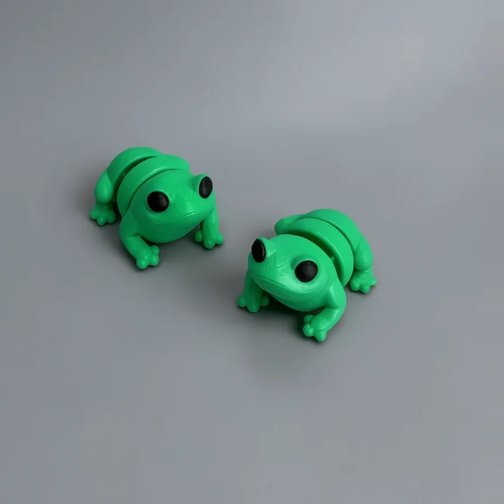 Baby Frog: green and black two identical segmented wobble/stretchy frog toys
