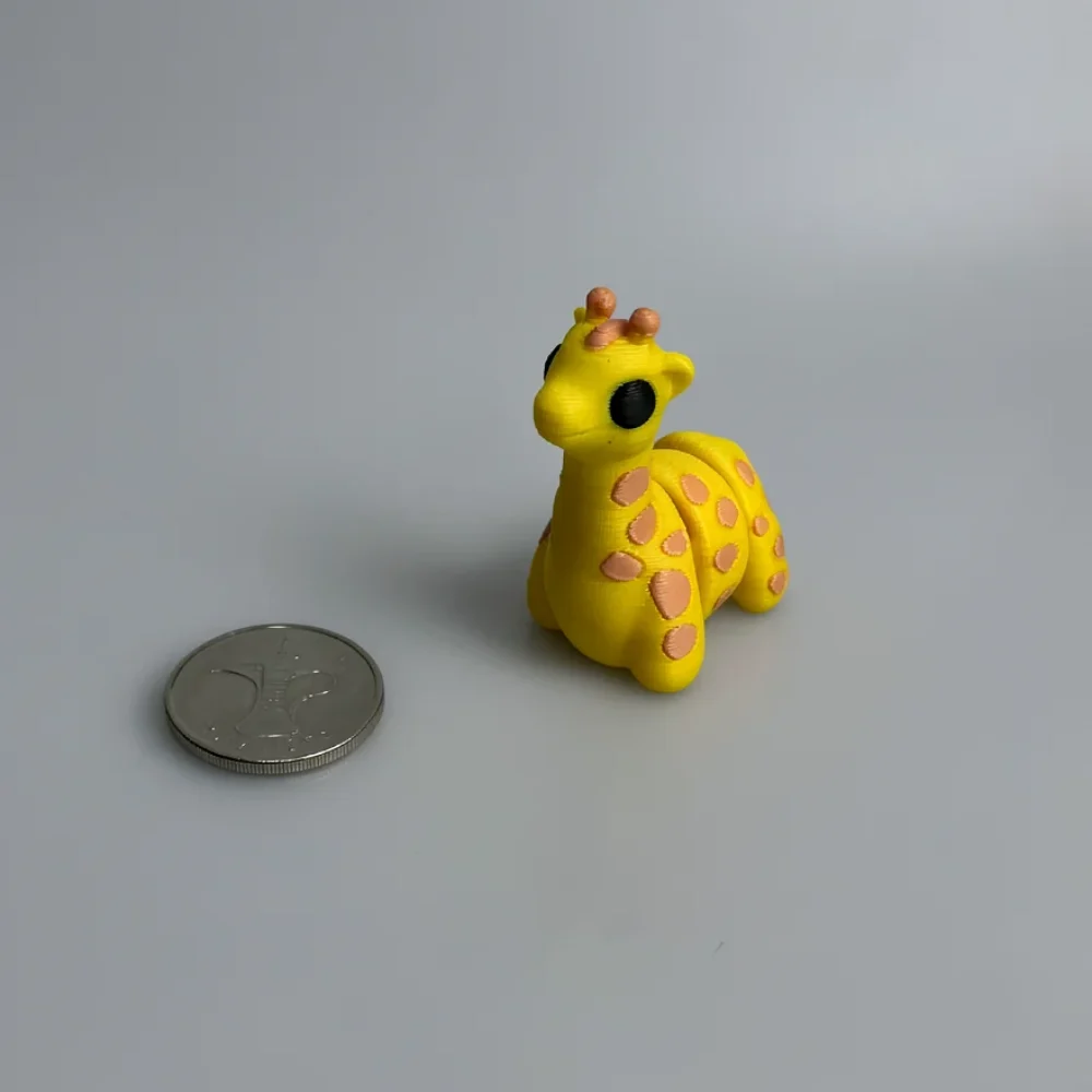 Baby Giraffe: yellow and orange stylized giraffe figurine, raised light orange/peach spots on neck and back