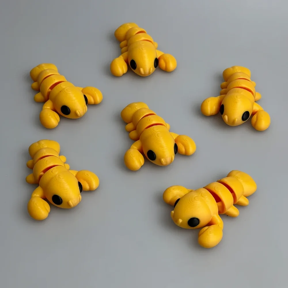 Baby Lobster: yellow and black articulated segmented caterpillar figurines (six identical pieces)