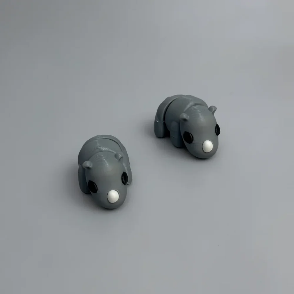 Baby Rhino: grey and black articulated animal figurine (rhinoceros or hippo-like)