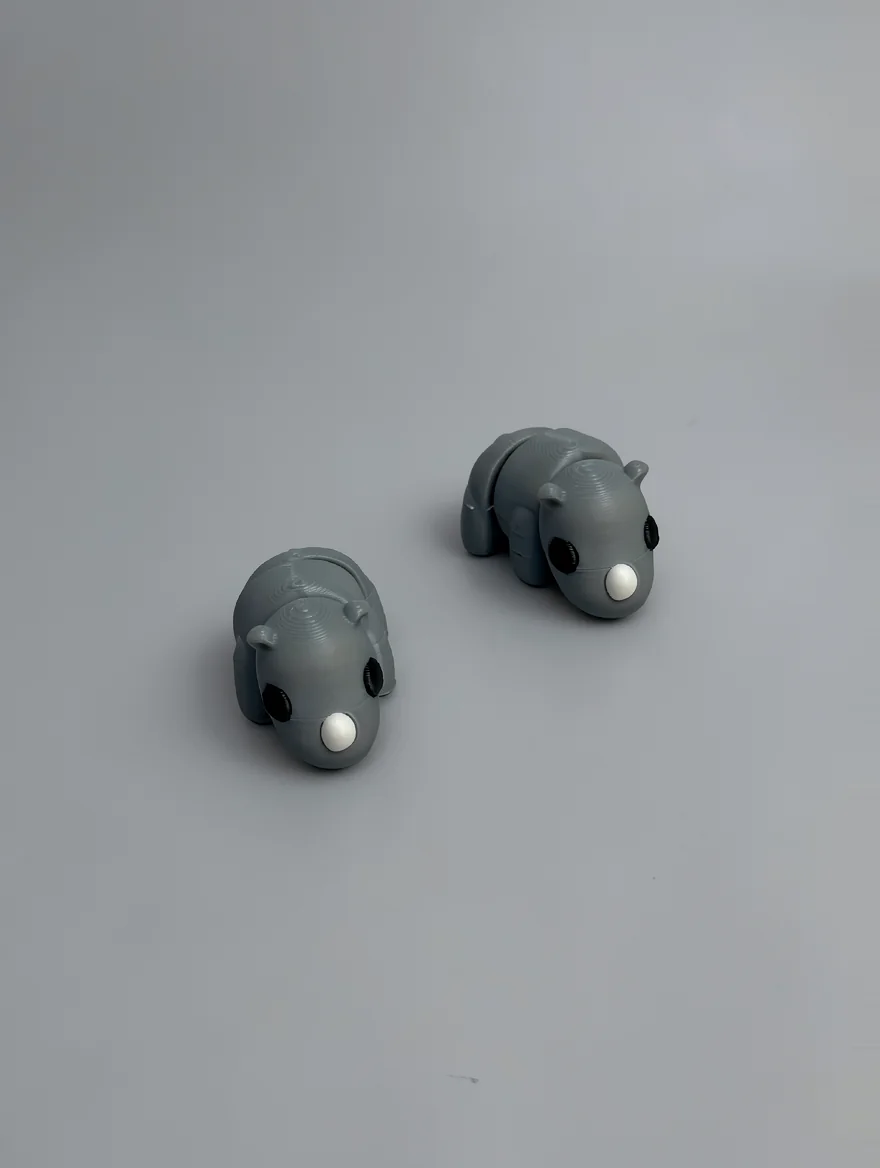 Baby Rhino: grey and black articulated animal figurine (rhinoceros or hippo-like)