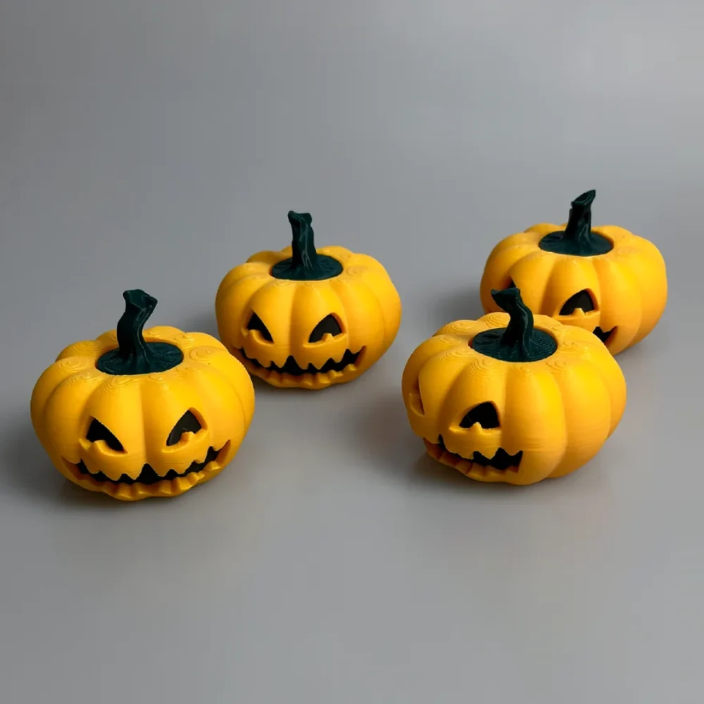Pumpkin Spinner: yellow-orange and dark green pumpkin figurines (set of four), triangular carved eyes