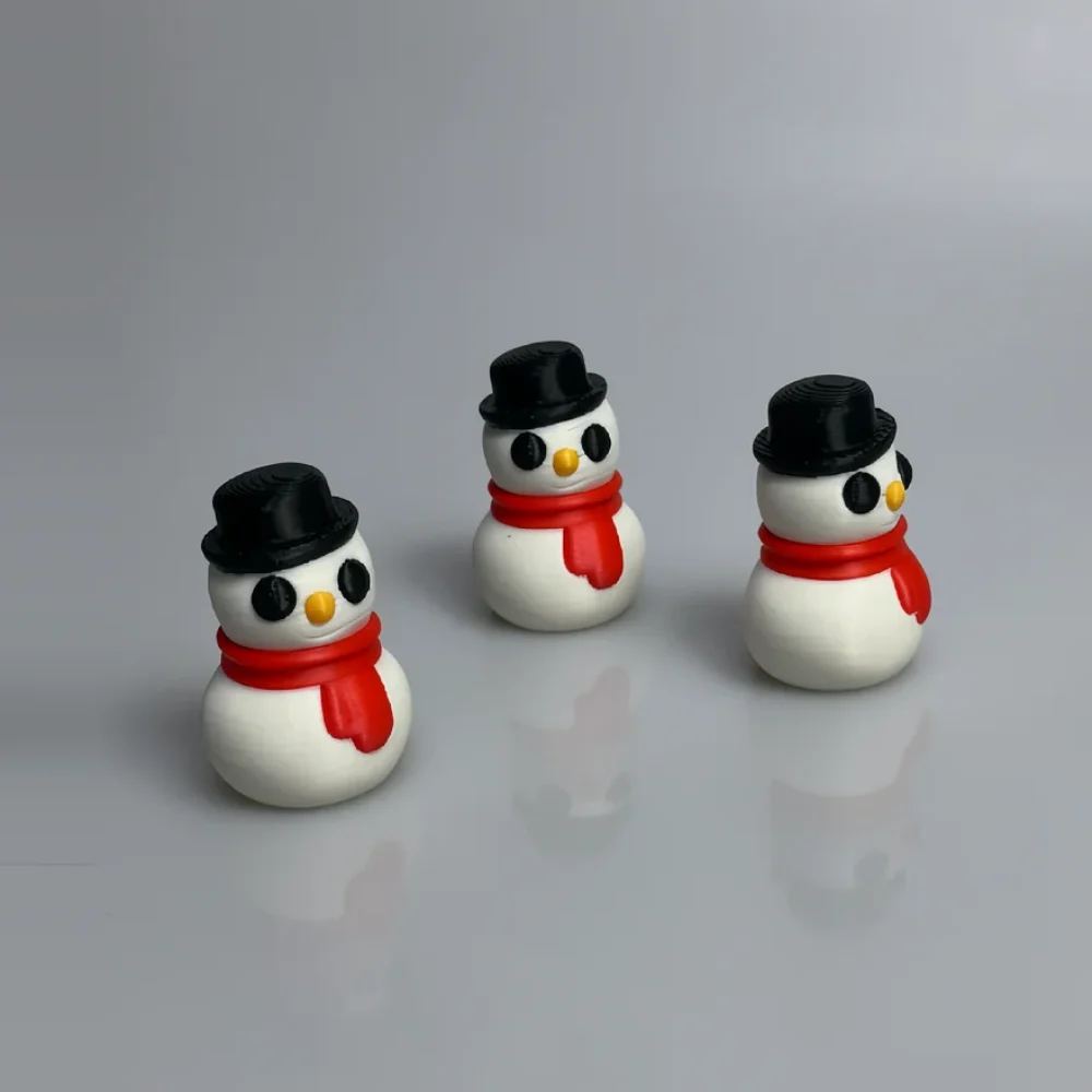 Snowman Sculpture: white and black snowman figurine, two-tiered spherical body (larger bottom sphere