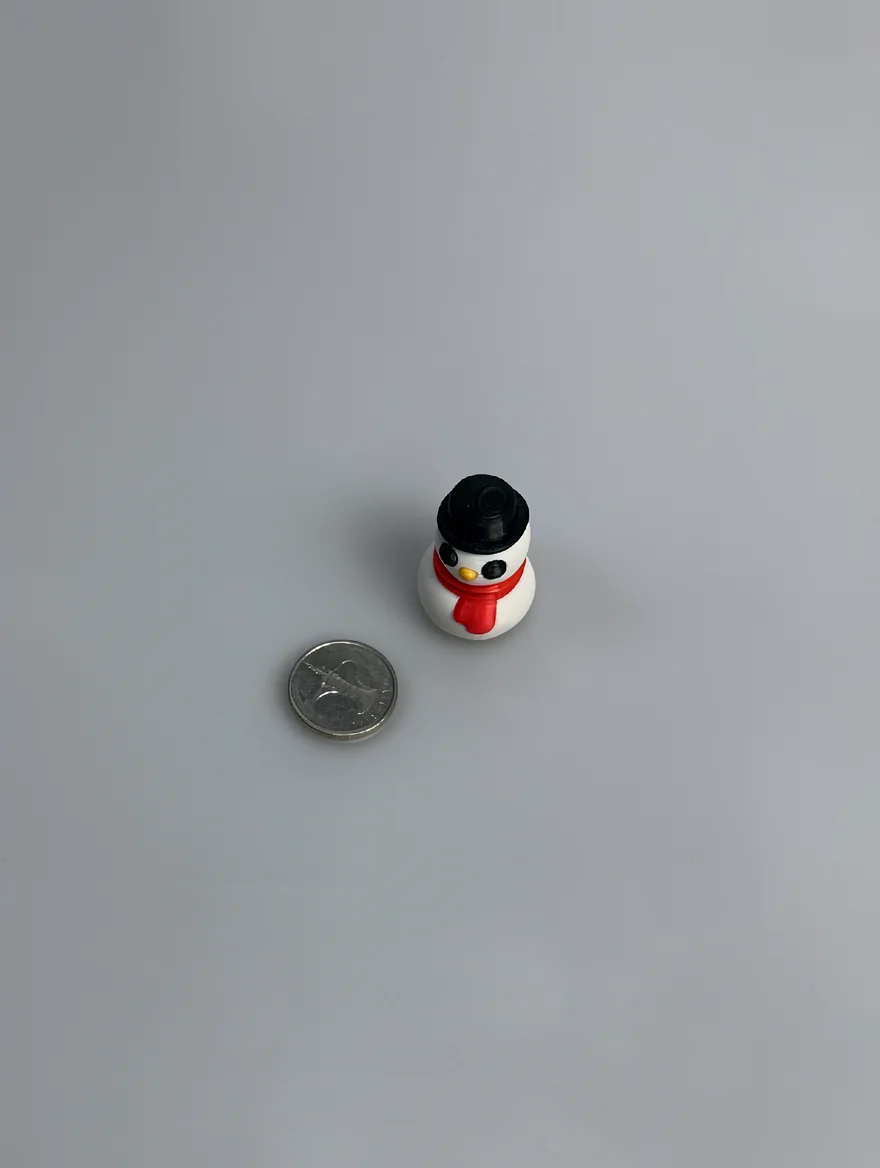 Snowman Sculpture: white and black snowman figurine, black top hat with brim and cylindrical crown