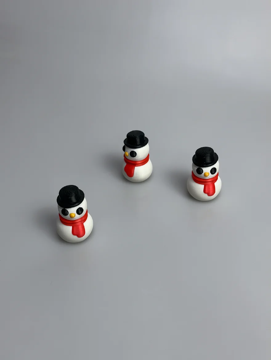 Snowman Sculpture: white and black snowman figurine (three identical pieces in one photo)
