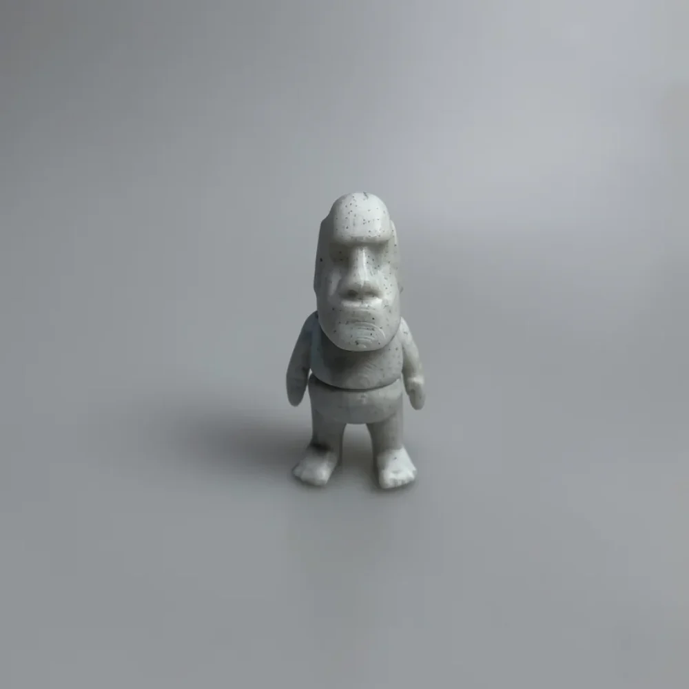 Tiny Moai: light grey and off-white Moai (Easter Island statue) figurine with chibi proportions