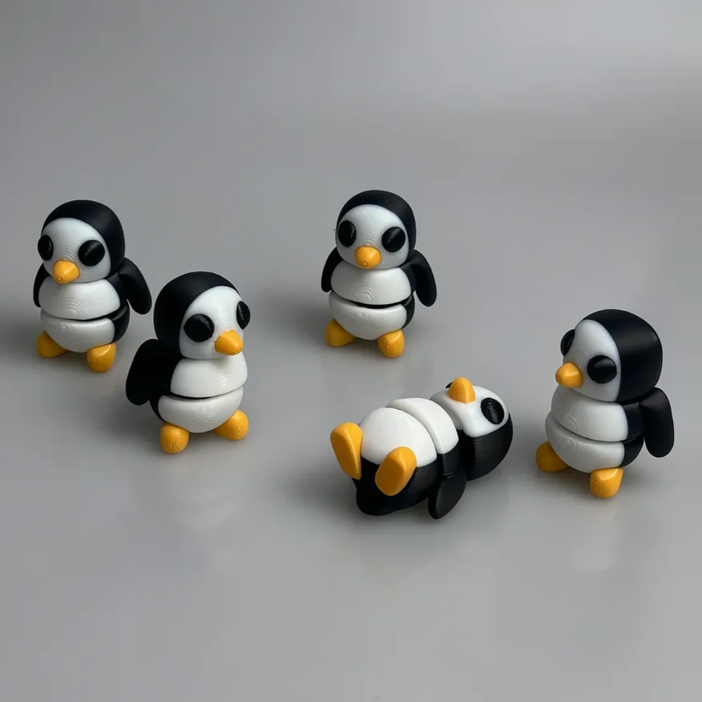 Tiny Penguin: black and white penguin figurines, chibi proportions - large heads, small bodies