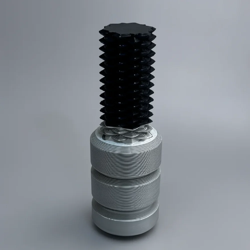 Two Way Screw: black and silver mechanical component, stack of sharp-edged disc-like ridges on black top