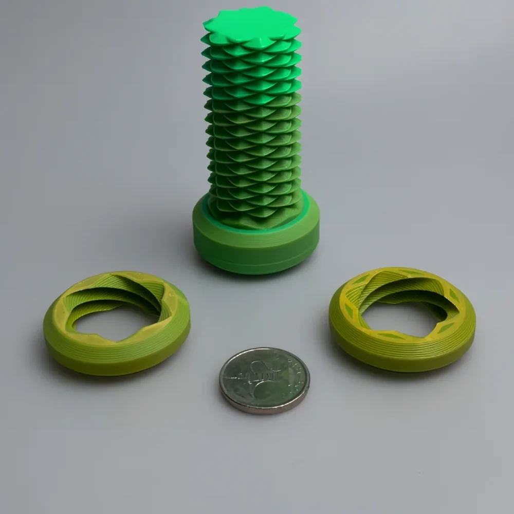 Two Way Screw: green and lime green modular geometric sculpture set, spiral pattern of stacked overlapping scales or petals