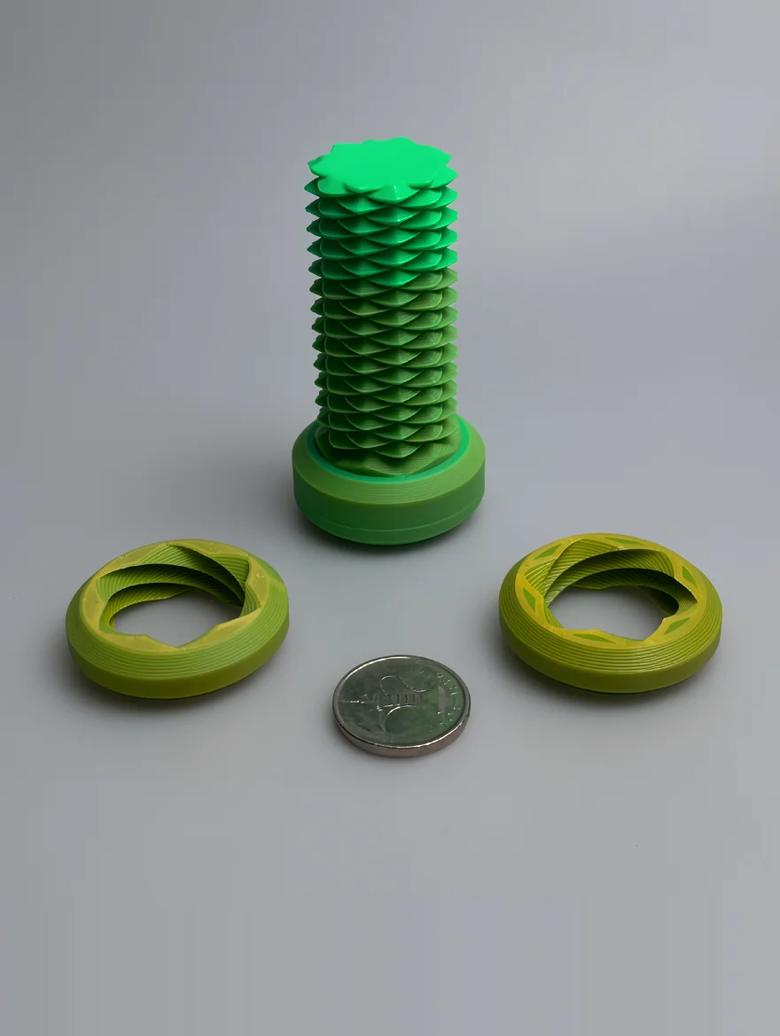 Two Way Screw: green and lime green modular geometric sculpture set, spiral pattern of stacked overlapping scales or petals