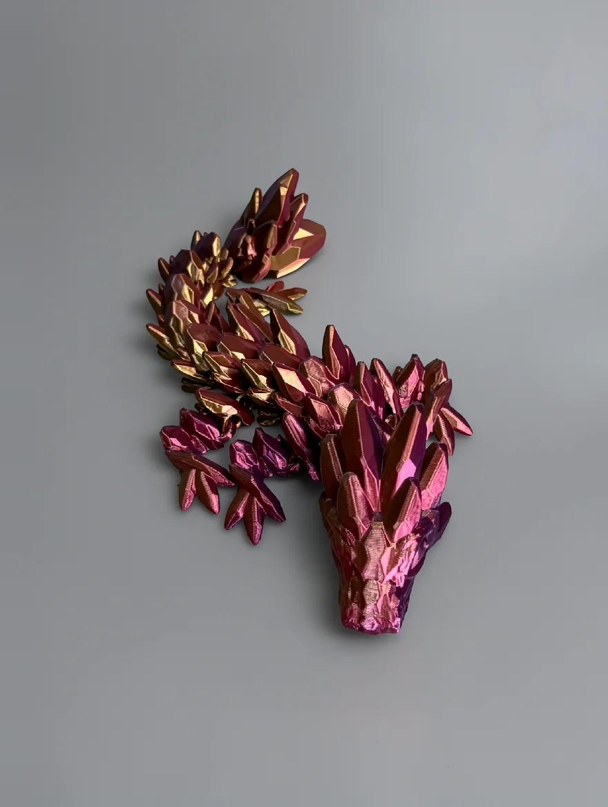 Baby Gemstone Dragon: magenta and pink dragon or mythical creature figurine with low-poly crystalline scale segments; a few…