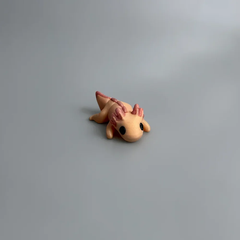 Baby Axolotl: pale peach and dusty pink axolotl figurine, three segmented gill stalks on each side of head