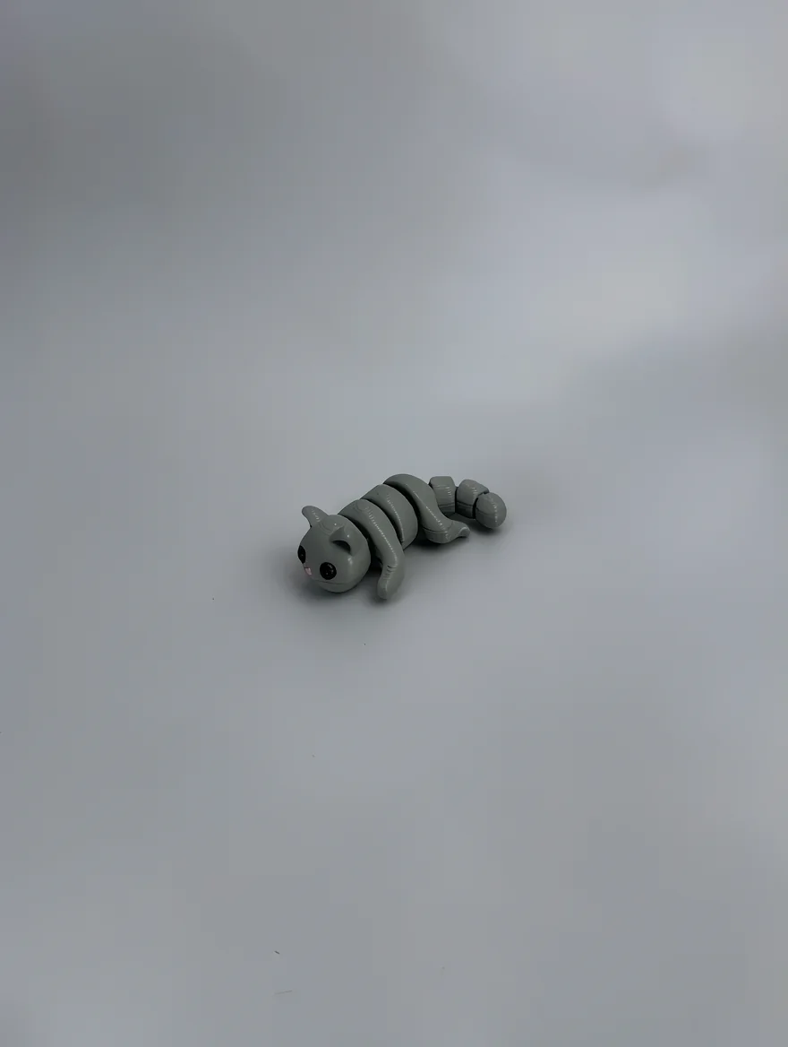 Baby Cat: grey segmented caterpillar/worm figurine, round smooth head