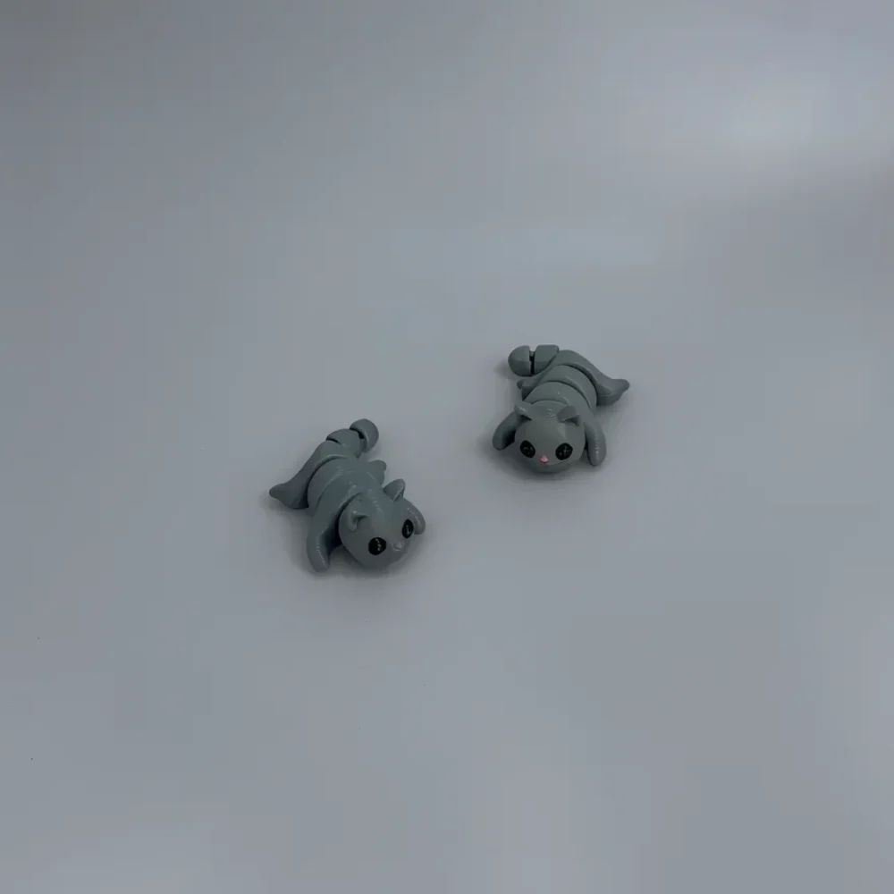 Baby Cat: grey and black articulated segmented caterpillar toy figures (cat and rabbit), multi-segmented articulated body