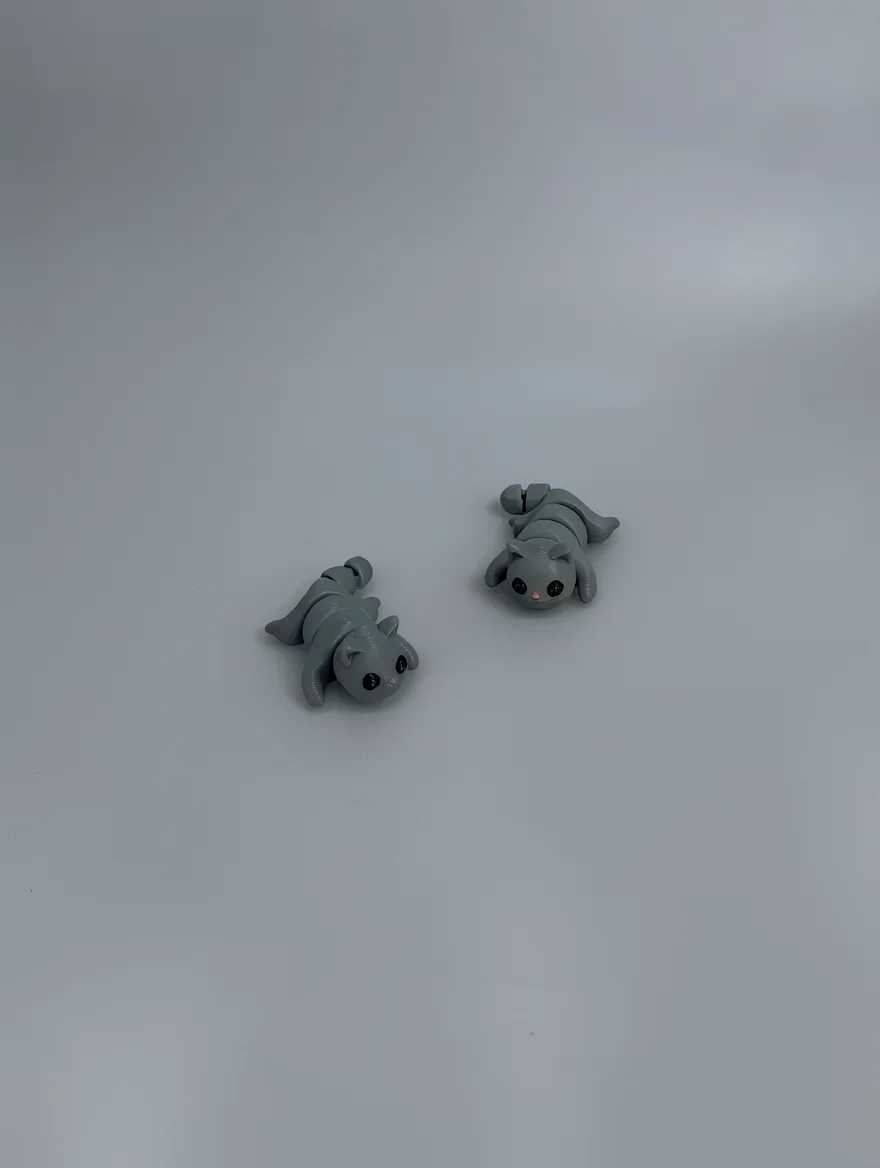Baby Cat: grey and black articulated segmented caterpillar toy figures (cat and rabbit), multi-segmented articulated body