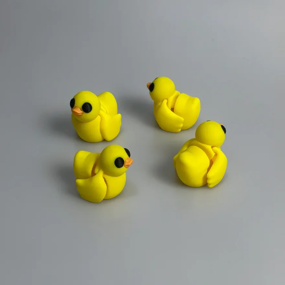 Baby Duck: yellow and orange four rubber duck figurines, orange beak on each duck