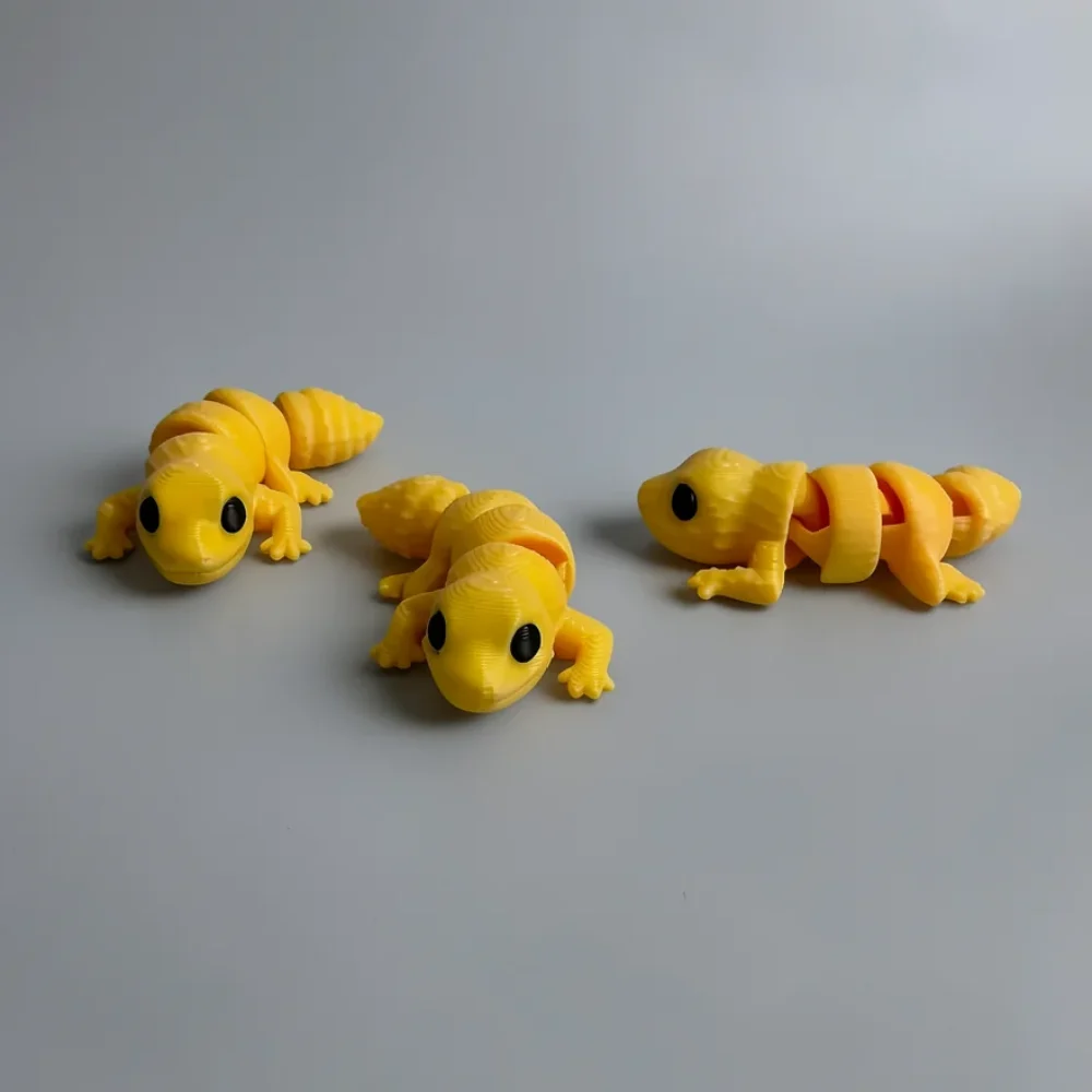 Baby Leopard Gecko: yellow and black three articulated lizard/gecko figurines, large round black eyes