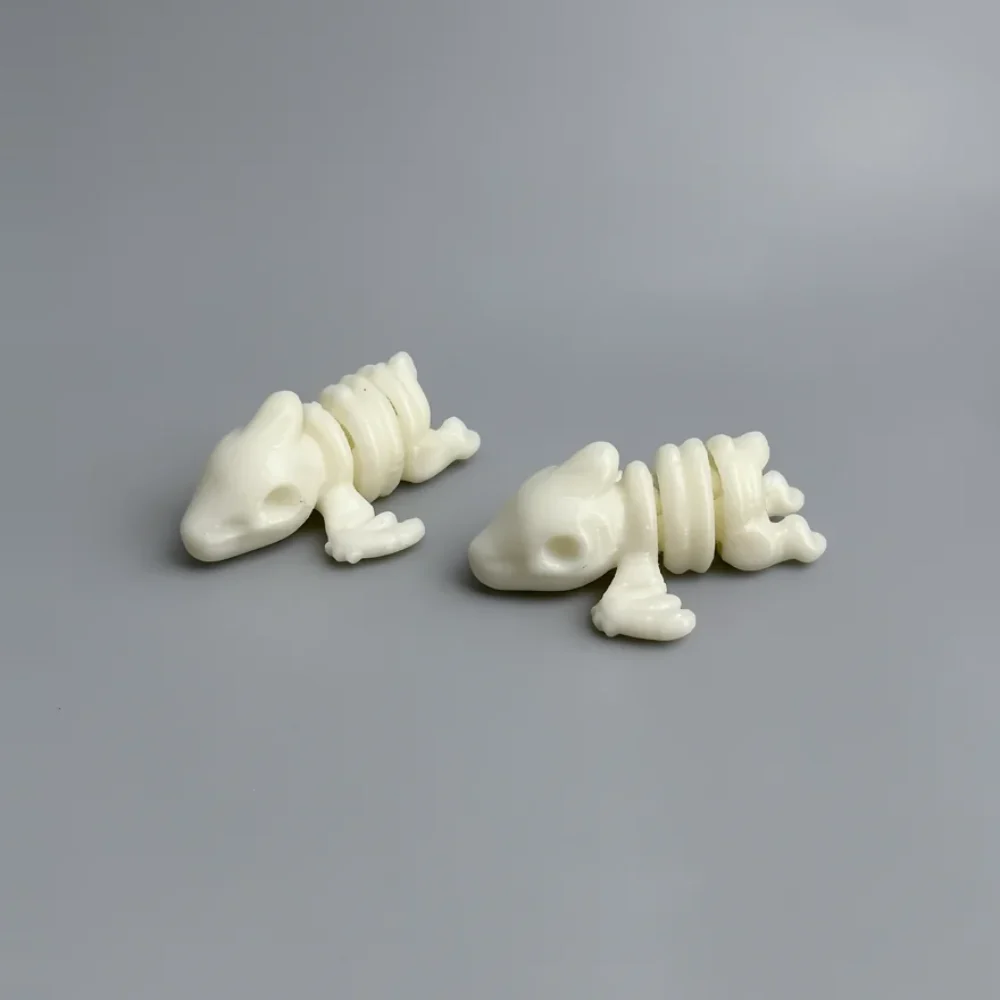 Baby Pterodactyl Skeleton: cream off-white Two articulated frog/toad figurines with segmented spine