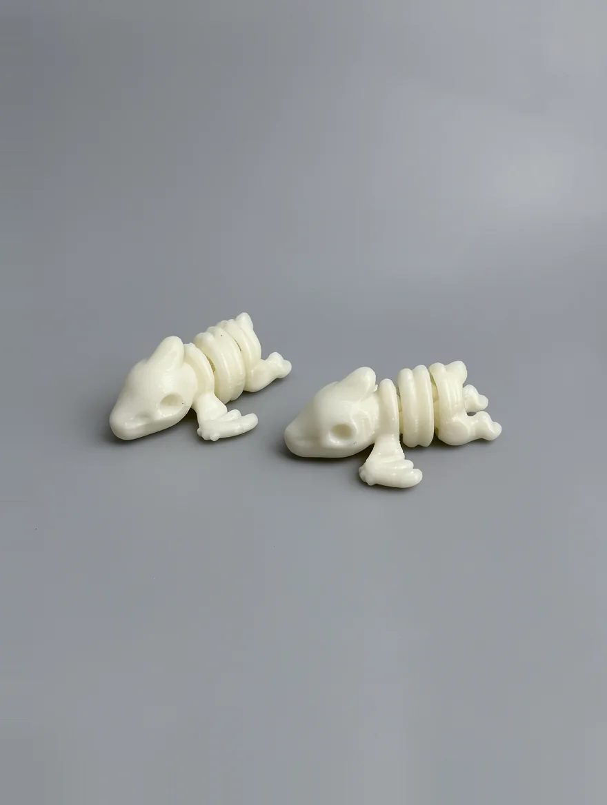 Baby Pterodactyl Skeleton: cream off-white Two articulated frog/toad figurines with segmented spine