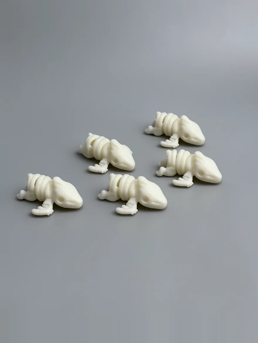 Baby Pterodactyl Skeleton: cream and off-white five identical small reptile-like creature figurines…