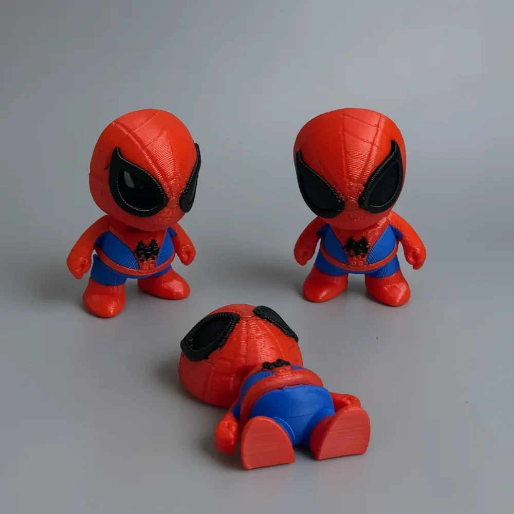 Spiderman: red and blue Spider-Man figurine, chibi proportions with oversized head and small body