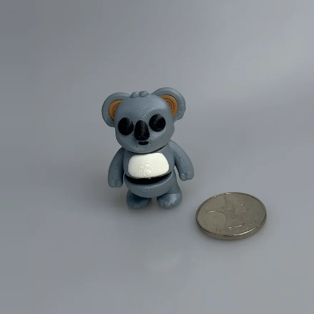 Tiny Koala Colorful: grey-blue and tan koala figurine, large rounded ears with tan inner surfaces