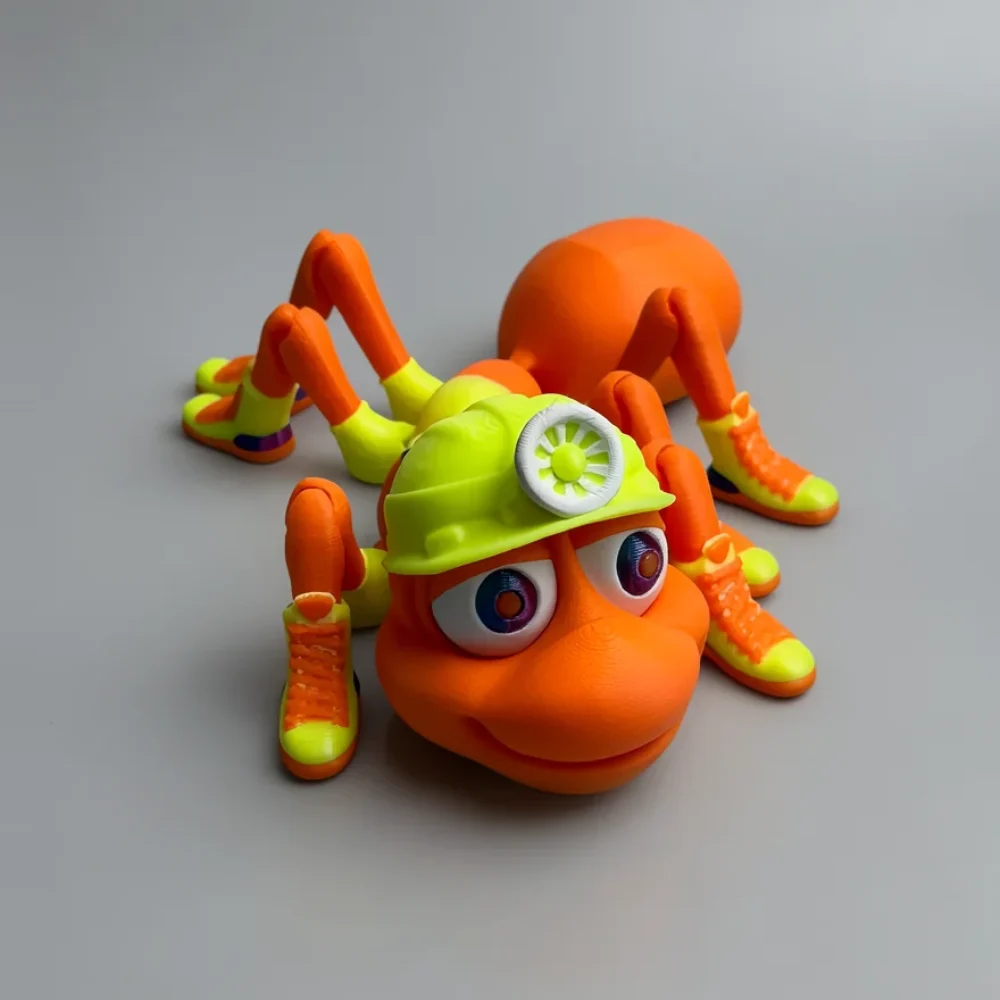 Coal Miner Ant: orange and lime green cartoonish insect figurine wearing a construction hard hat