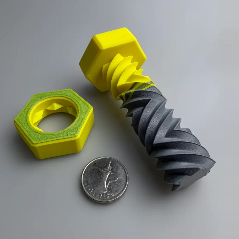 Zigzag Bolt Nut: yellow and dark grey interlocking bolt and nut set (3D-printed collectible), hexagonal bolt head