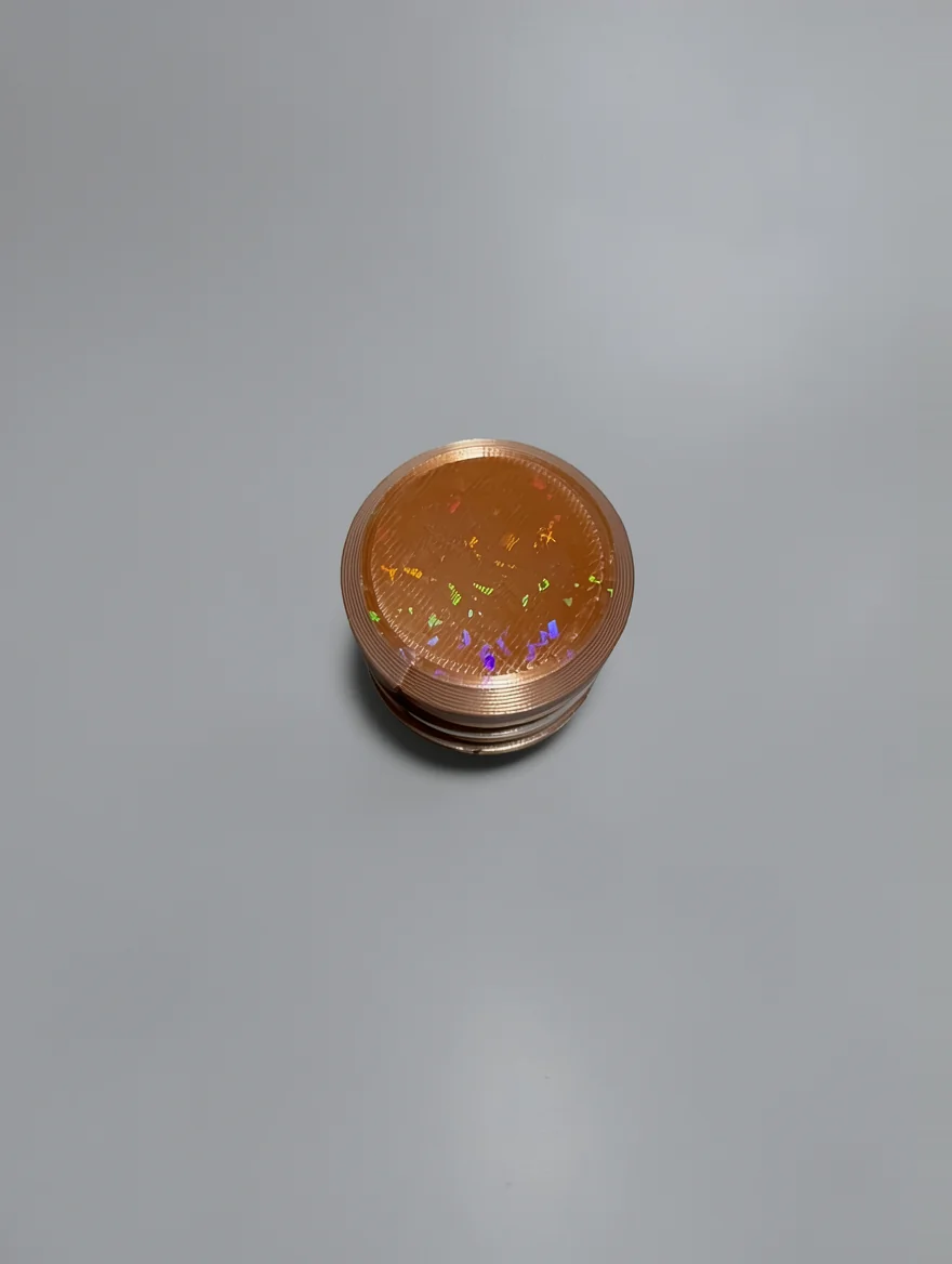 Two Way Screw: copper and bronze cylindrical container with screw-top lid, horizontal knurling ridges on sides