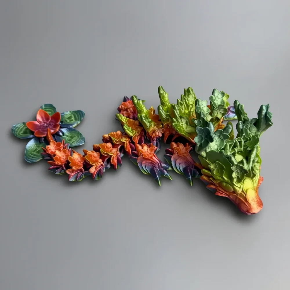Baby Cherry Blossom Dragon: teal and blue segmented plant sculpture with rosette formations