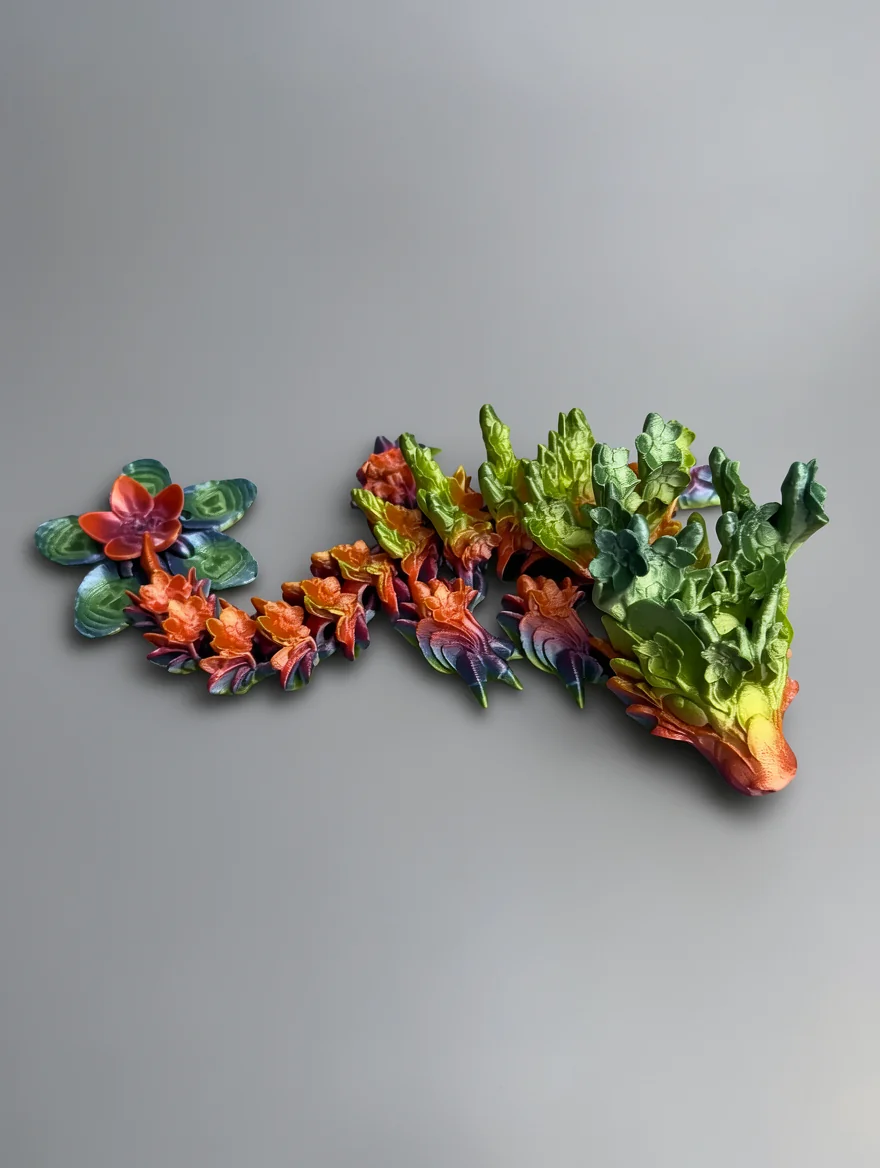 Baby Cherry Blossom Dragon: teal and blue segmented plant sculpture with rosette formations