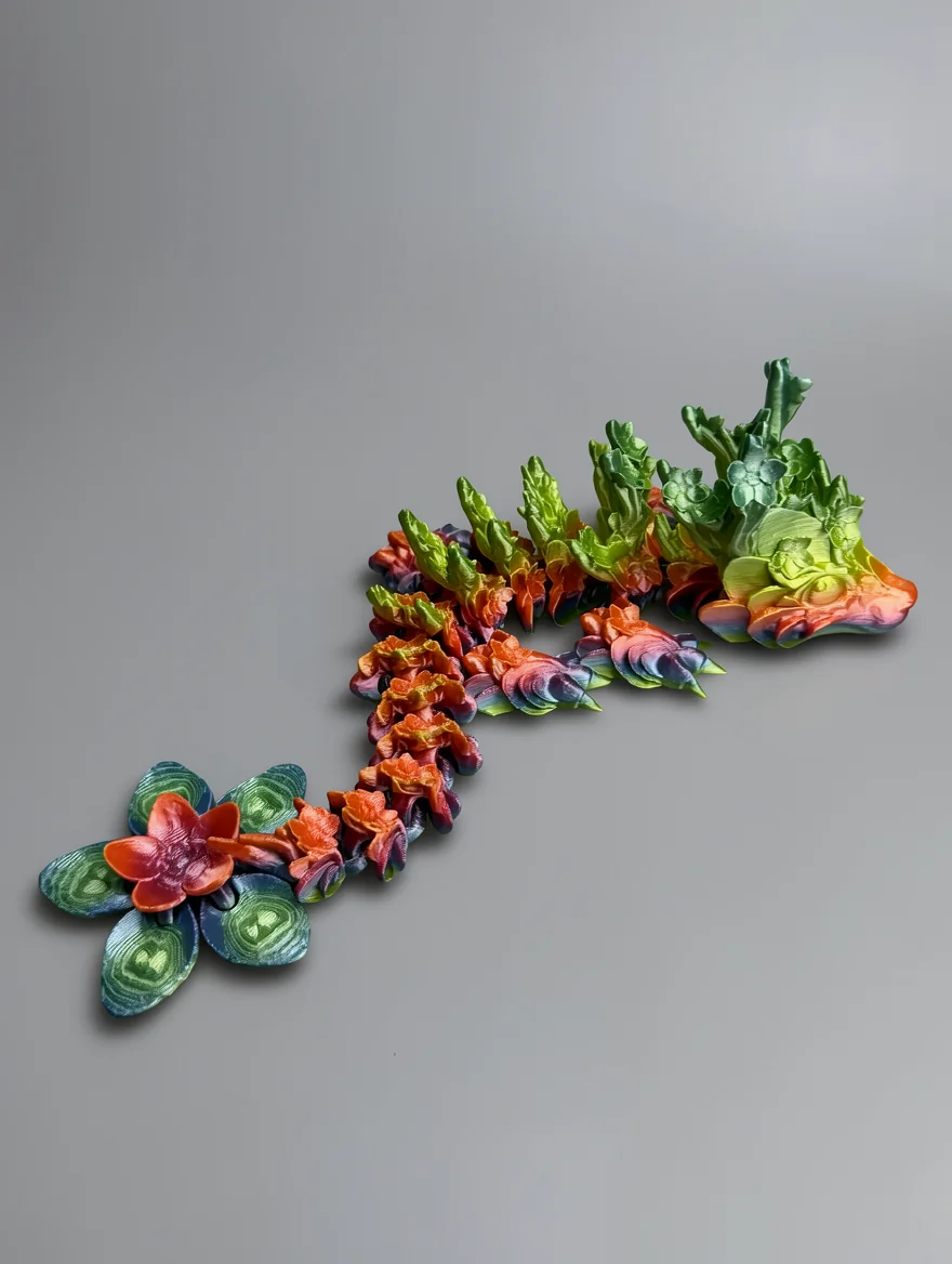 Baby Cherry Blossom Dragon: green and yellow multi-colored botanical sculpture with leaf clusters, flower elements, and…