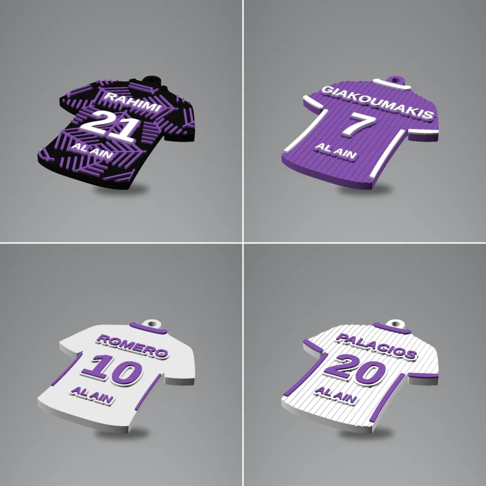 Jersey Keychain: black and purple set of four jersey-shaped keychains, small attachment loop at top center of each piece