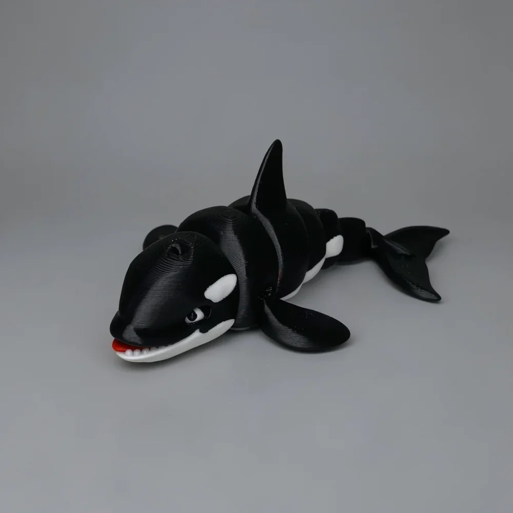 Orca: black and white articulated 3D-printed Orca (Killer Whale) figurine with segmented body