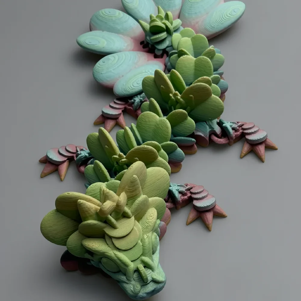 Baby Lucky Clover Dragon: pale green and teal dragon figurine made of succulent plant parts