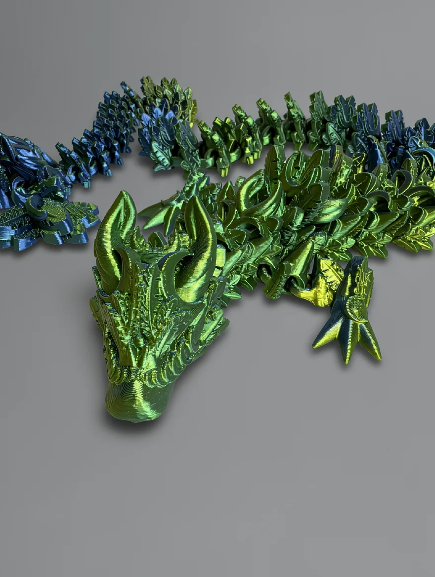 Lunar Dragon: green and blue articulated dragon figurine, two curved horns sweeping backward